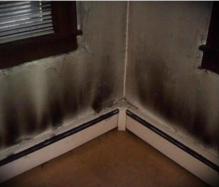 Notable soot, dirt & oil residue is present on radiators, walls and blinds 